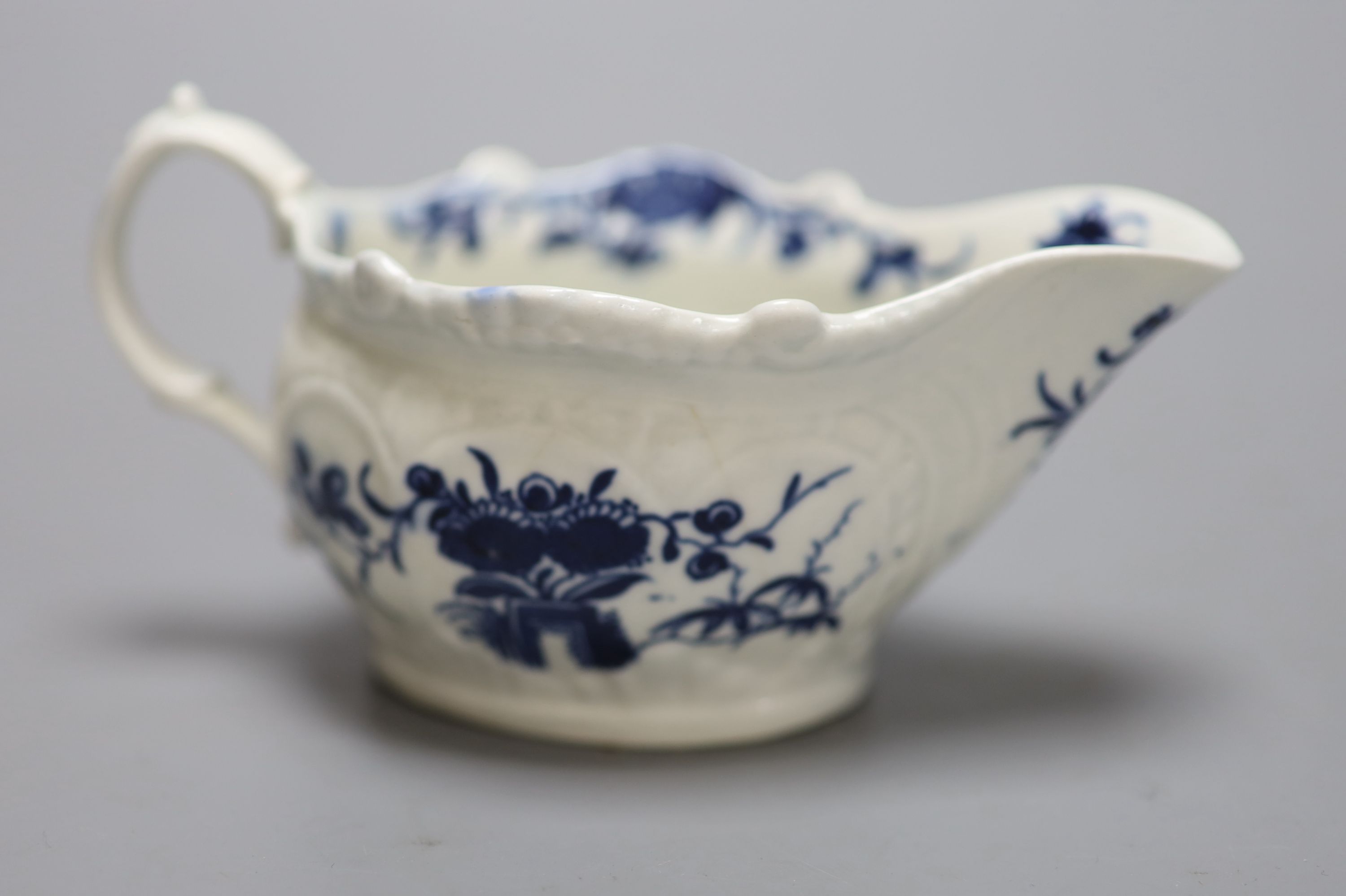 An 18th century Worcester two porter  pattern cream boat, crescent mark, length 14cm